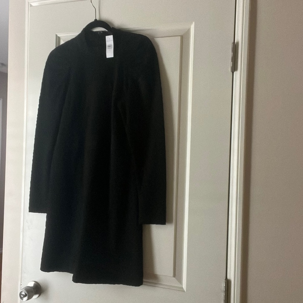 Brand new (with tag) Ann Taylor size 2 black lined dress, knee length.